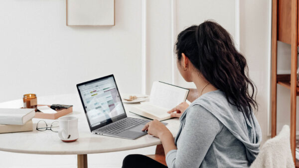 Person working from home on laptop computer.